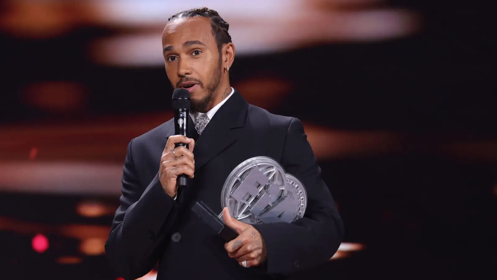 Lewis Hamilton addresses the audience at the FIA Prize Giving Gala in Azerbaijan, where he received his third-place trophy.