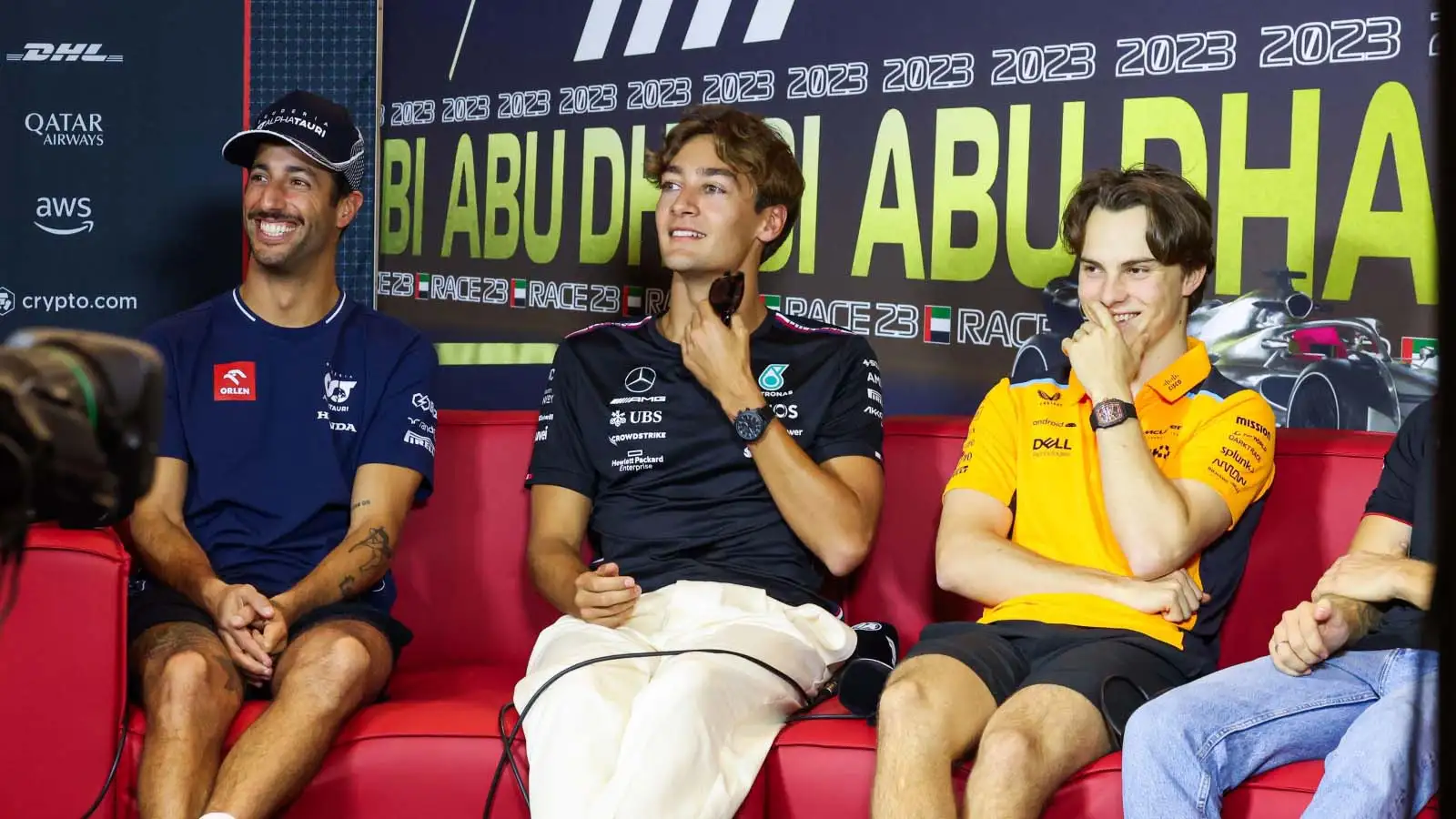 George Russell sat between Daniel Ricciardo and Oscar Piastri.