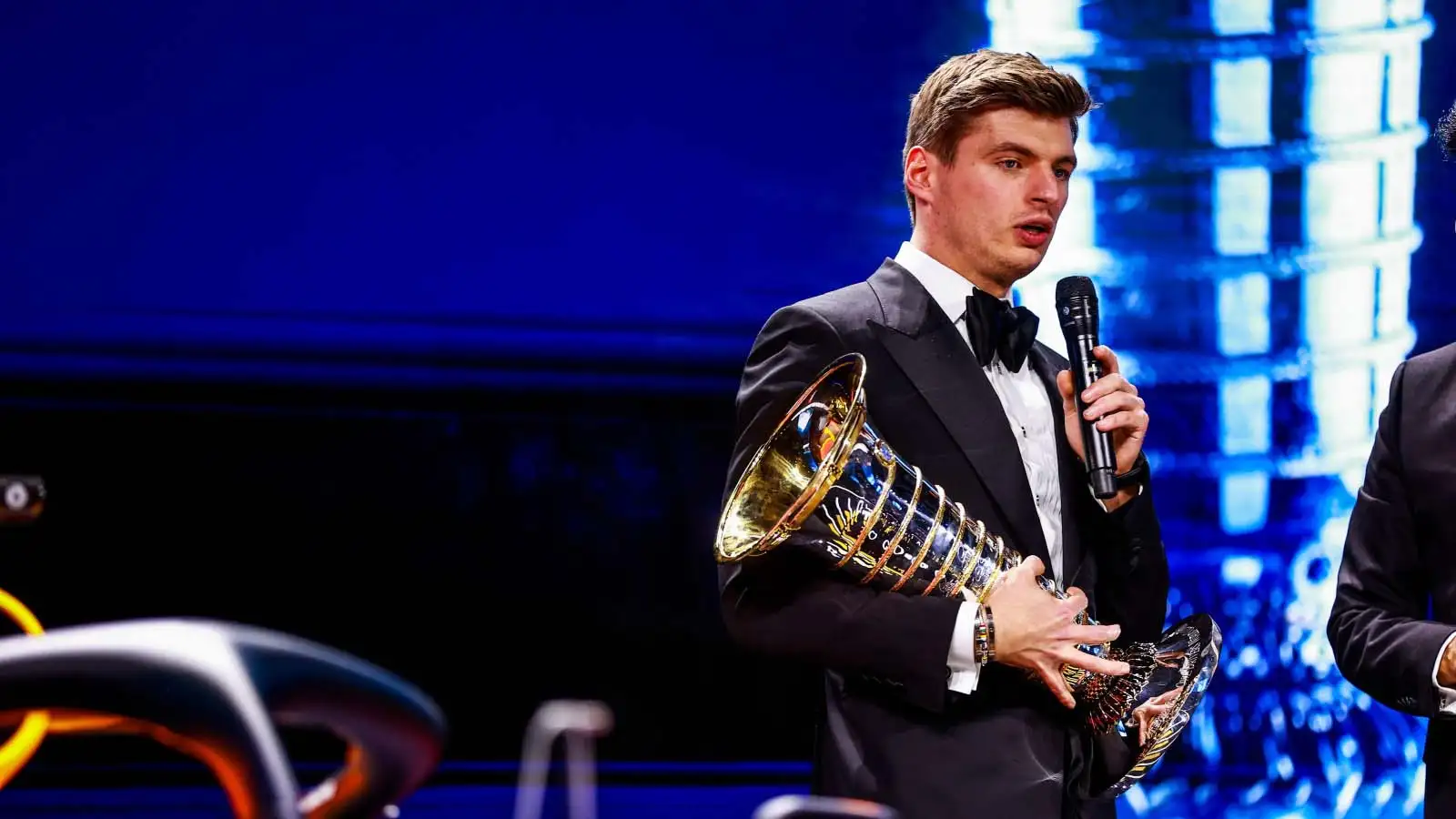 Max Verstappen with the Drivers Championship trophy.