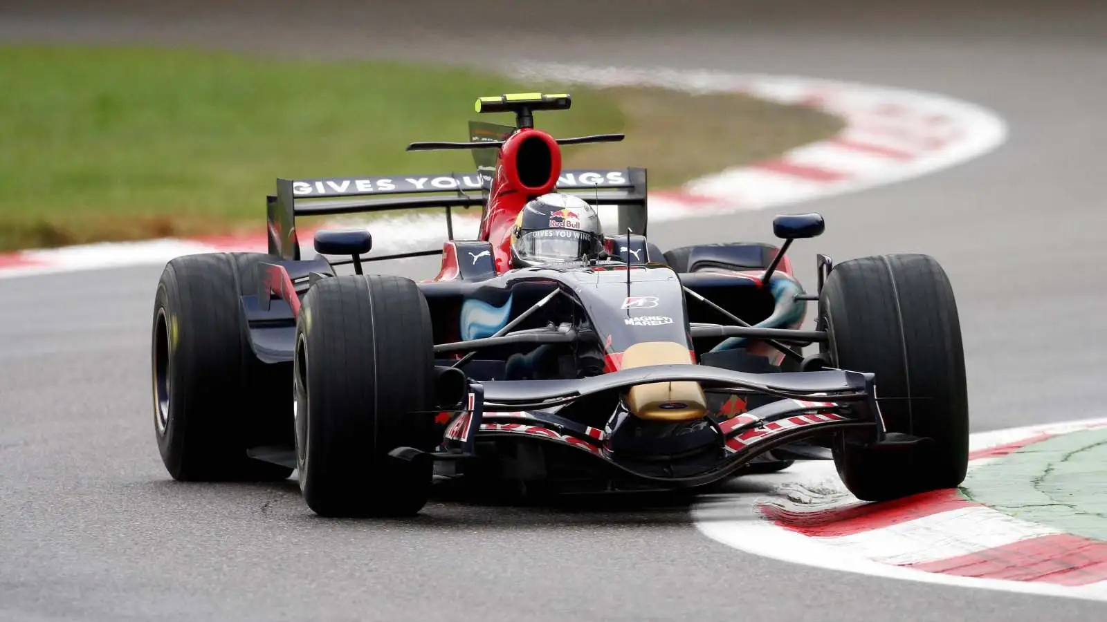 Sebastian Vettel drives an Adrian Newey designed Toro Rosso.