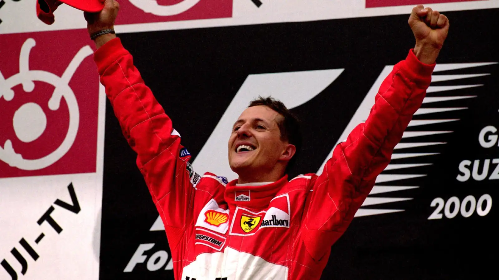 Michael Schumacher celebrates his title win at Suzuka in 2000.