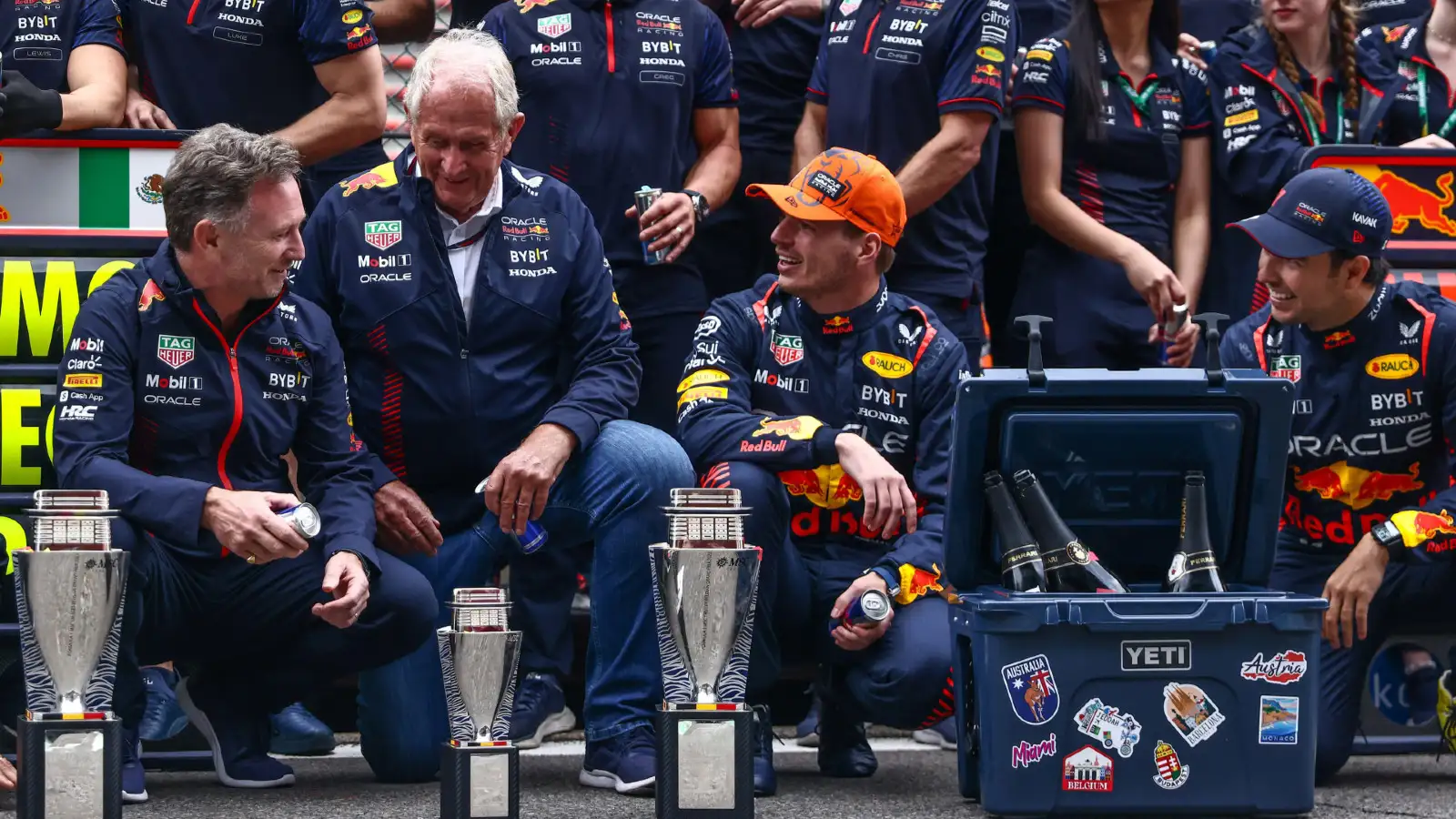 Christian Horner celebrates victory with Max Verstappen and Sergio Perez