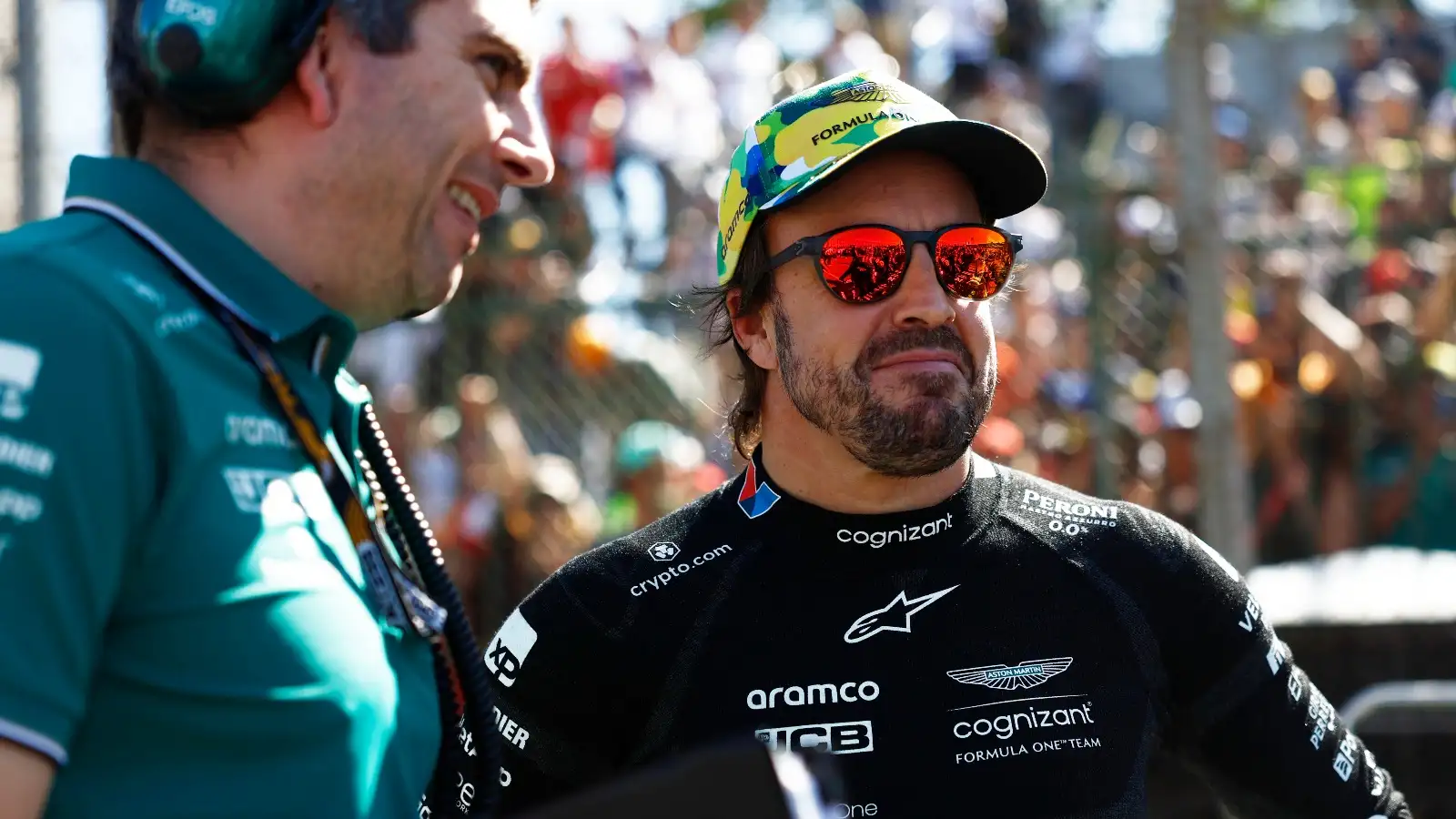 Fernando Alonso smiles on the grid.