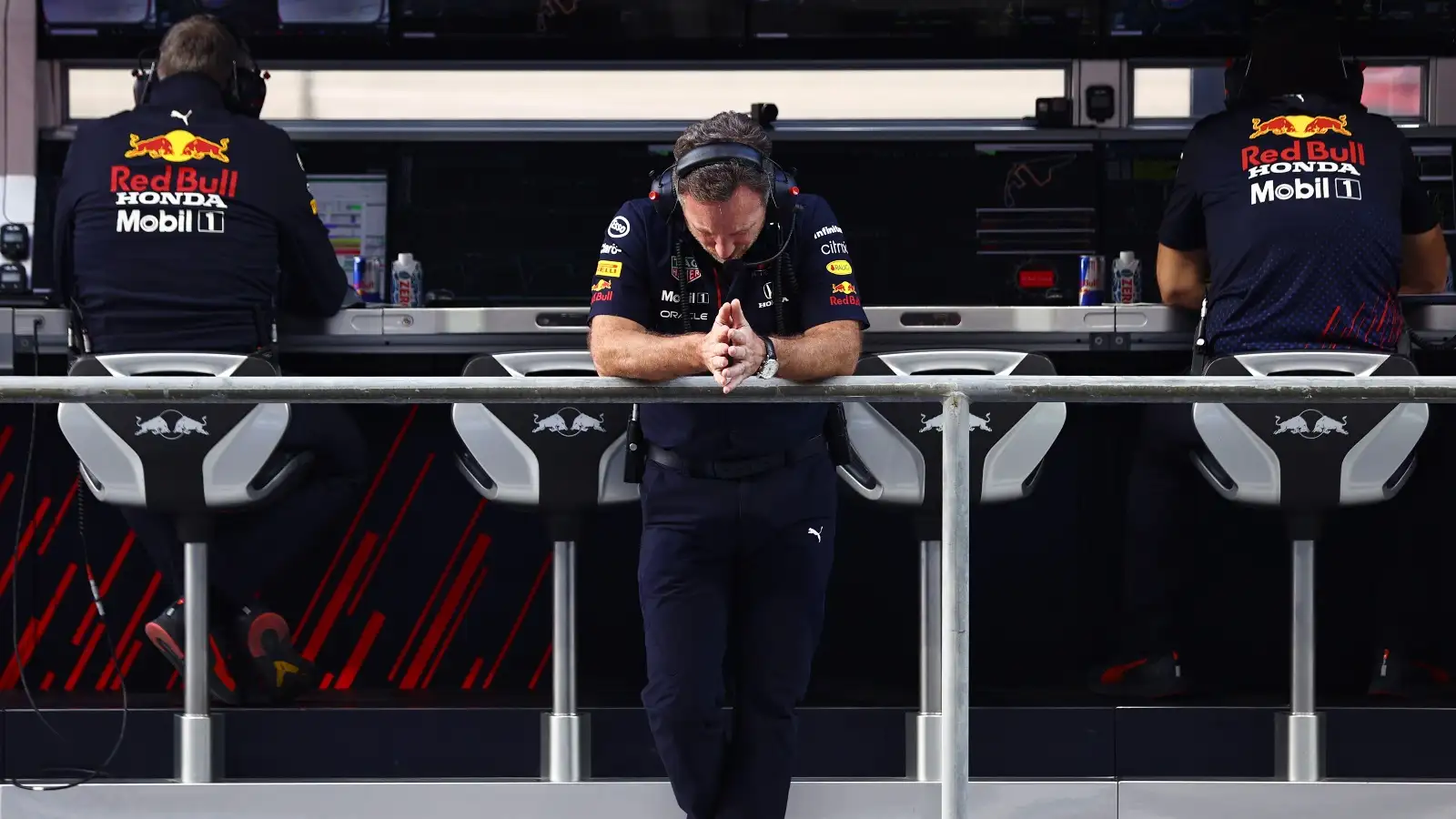 Christian Horner looks down in the pit wall.