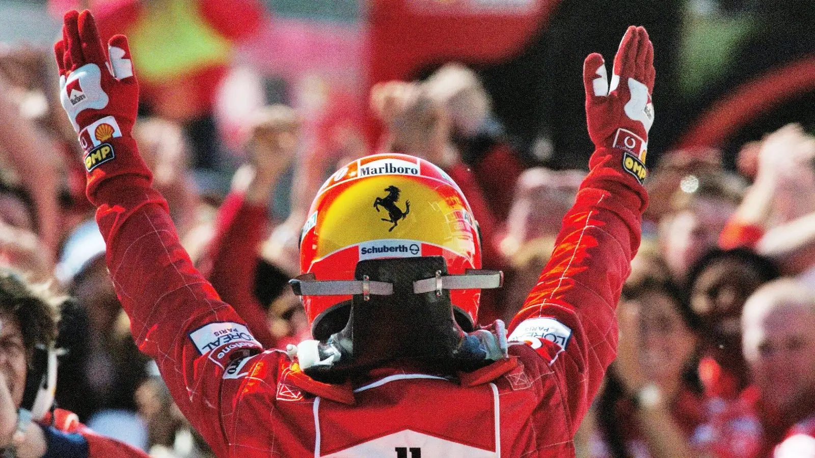 Michael Schumacher celebrates victory.