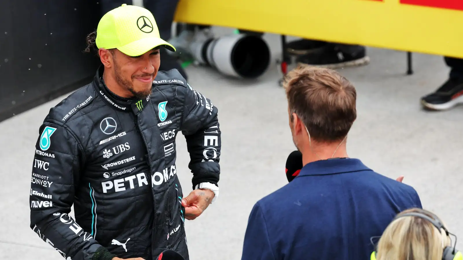 Lewis Hamilton being interviewed by Jenson Button.