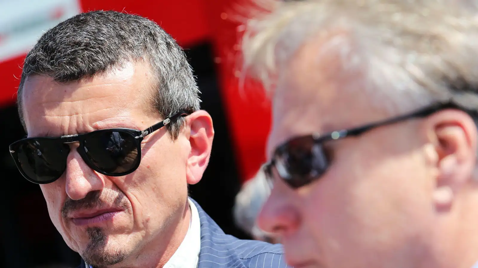 Former Haas team principal Guenther Steiner and owner Gene Haas wearing sunglasses.