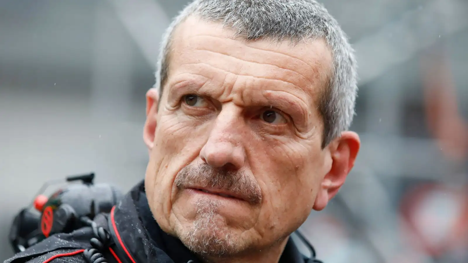 Former Haas team boss Guenther Steiner studies the conditions at the 2023 Austrian Grand Prix.