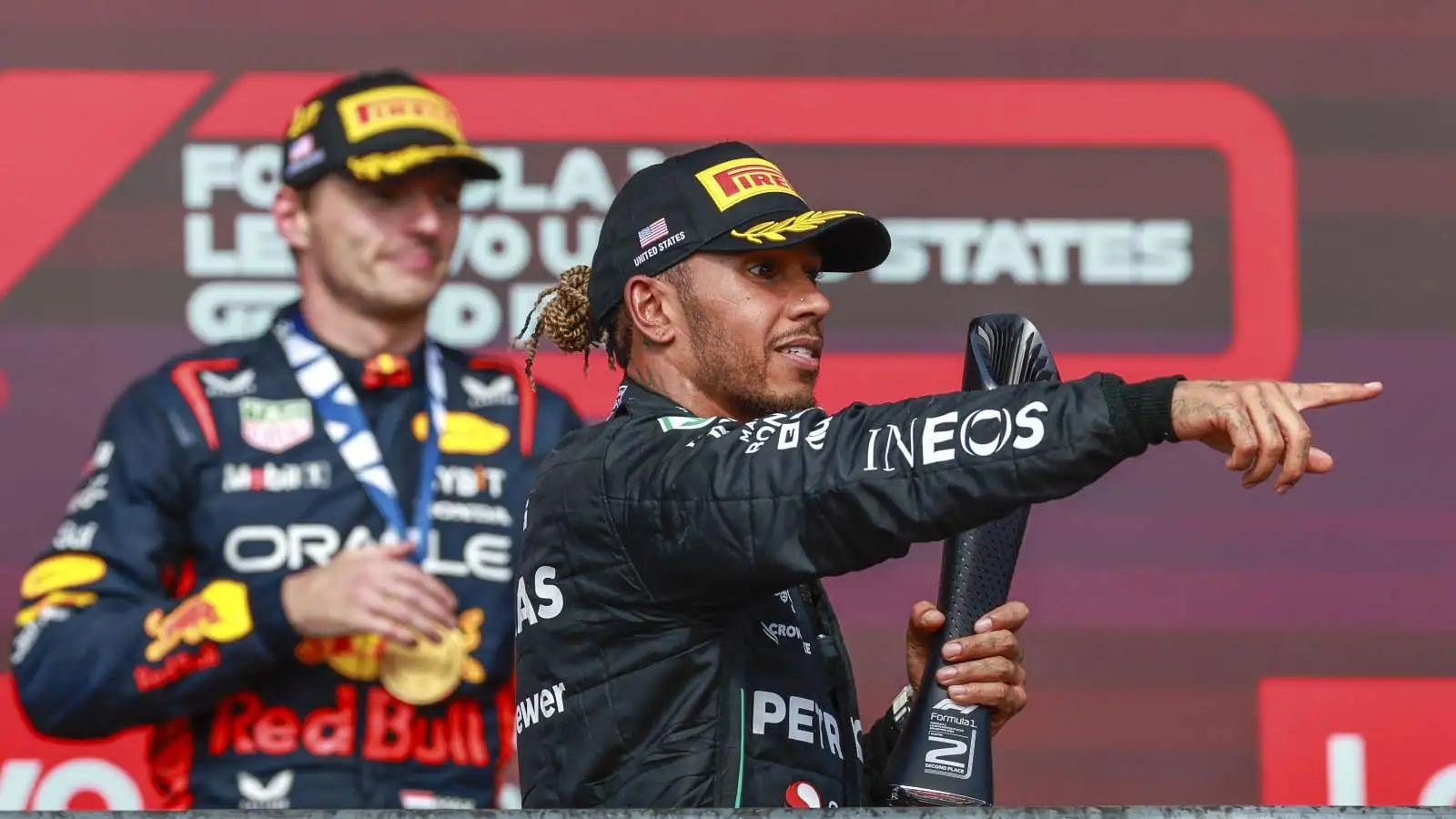 Lewis Hamilton in front of Max Verstappen on the podium.