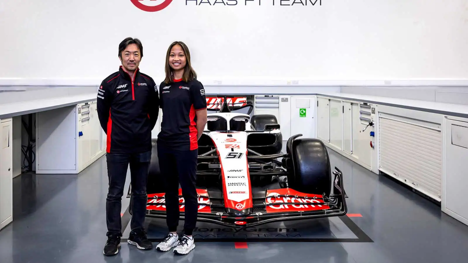 Haas team principal Ayao Komatsu with Chloe Chambers.