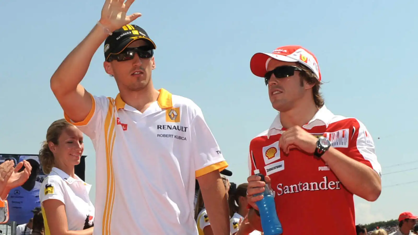 Robert Kubica alongside Fernando Alonso.