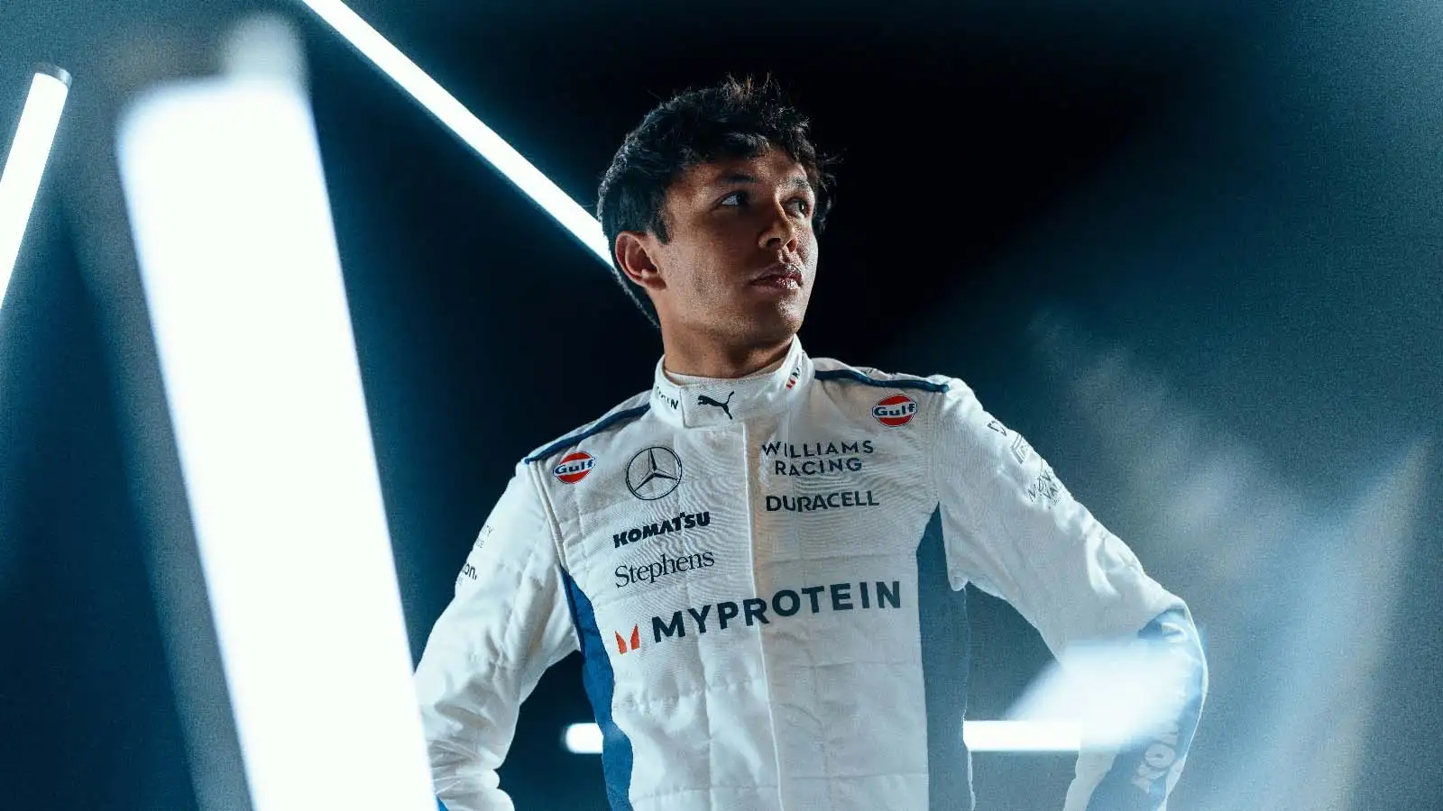 Alex Albon poses in the new Williams race suit.