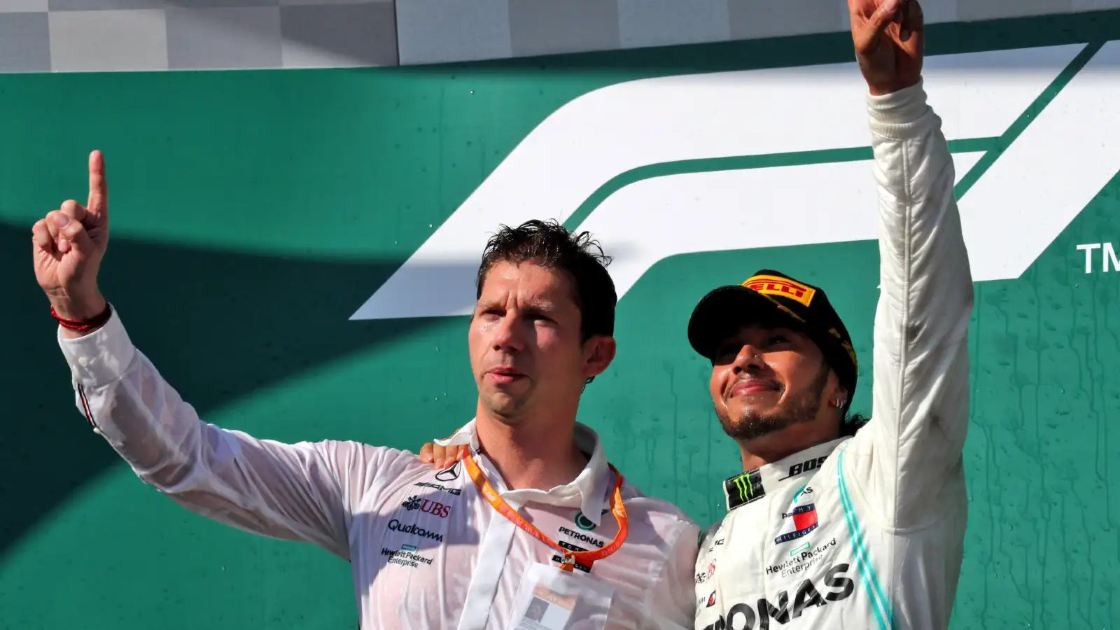 Mercedes' James Vowles celebrates on the podium with Lewis Hamilton at the 2019 Hungarian Grand Prix.