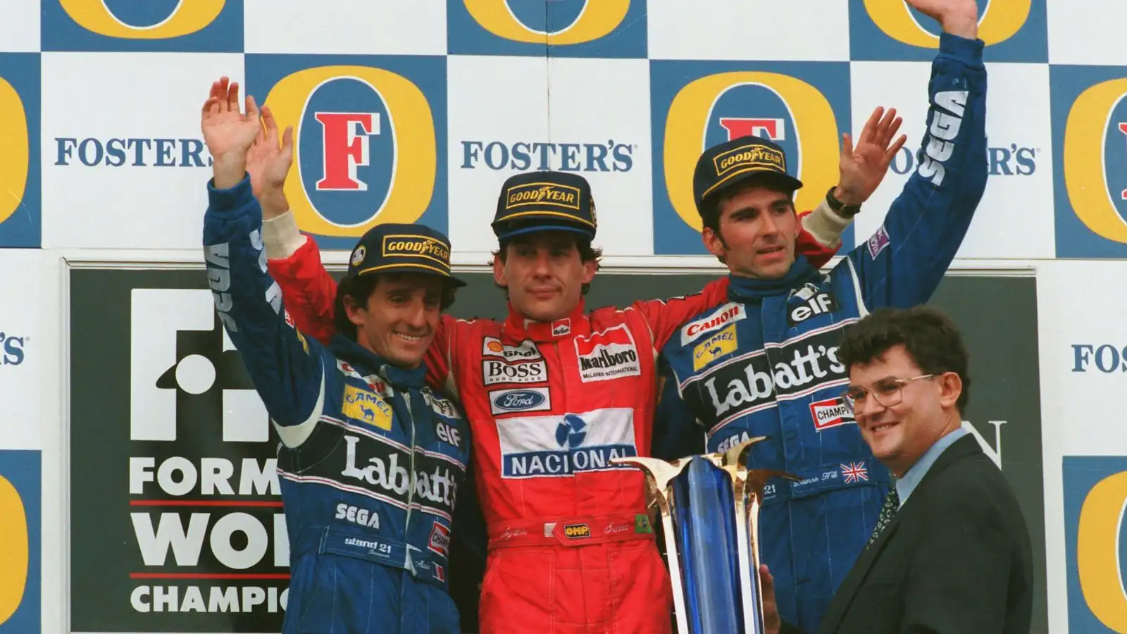 Ayrton Senna is flanked by Williams drivers Alain Prost and Damon Hill on the podium following his final F1 victory at Adelaide 1993.