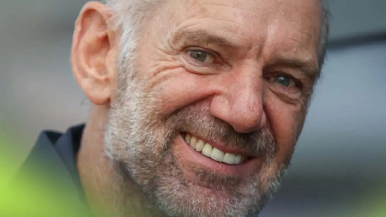 A close-up shot of a smiling Adrian Newey