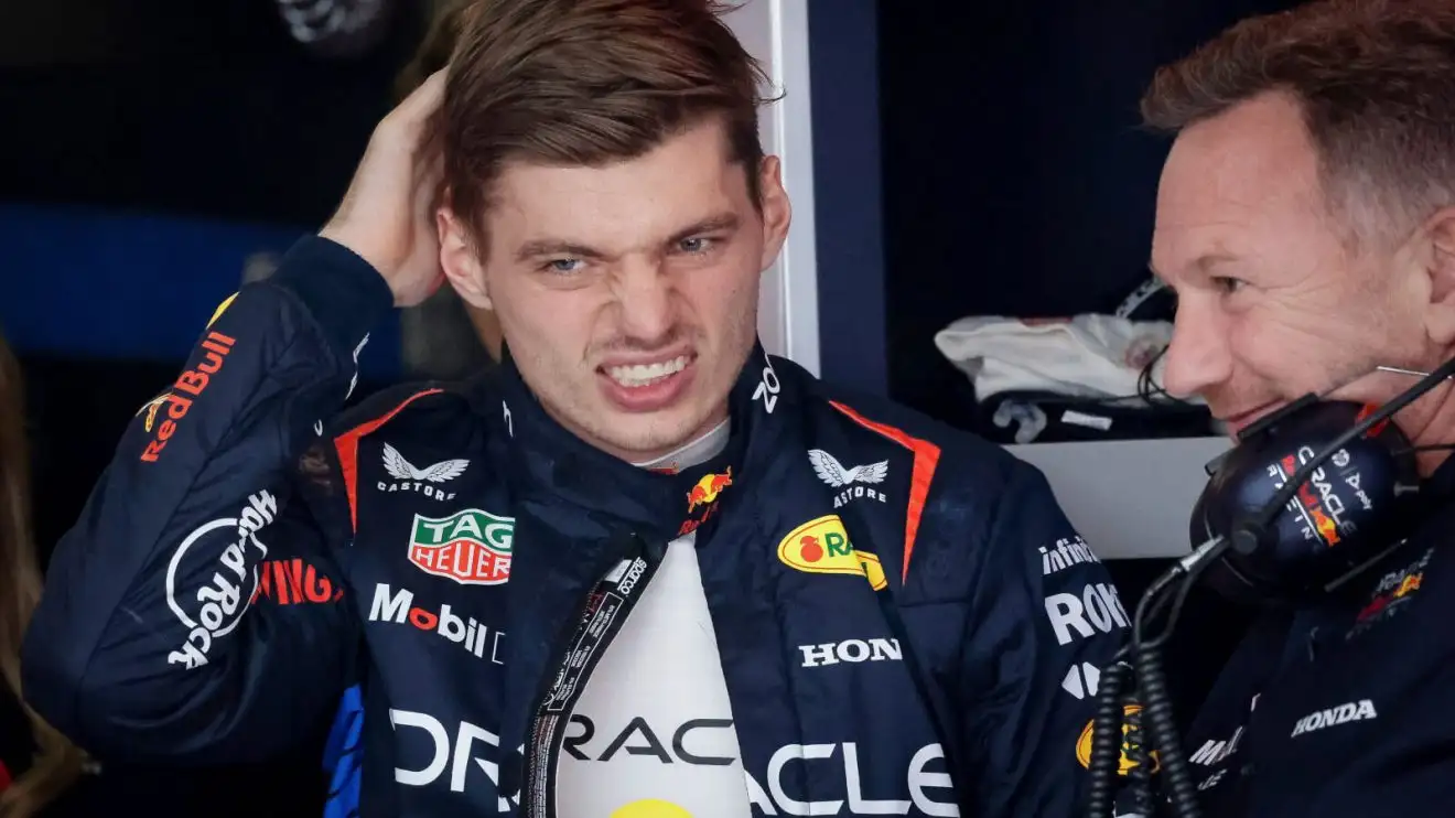 Max Verstappen hand to head next to Christian Horner