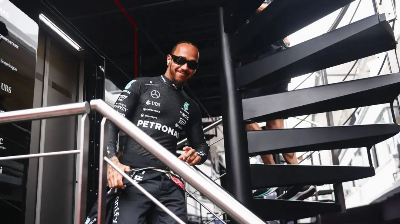 Lewis Hamilton walking down the stairs