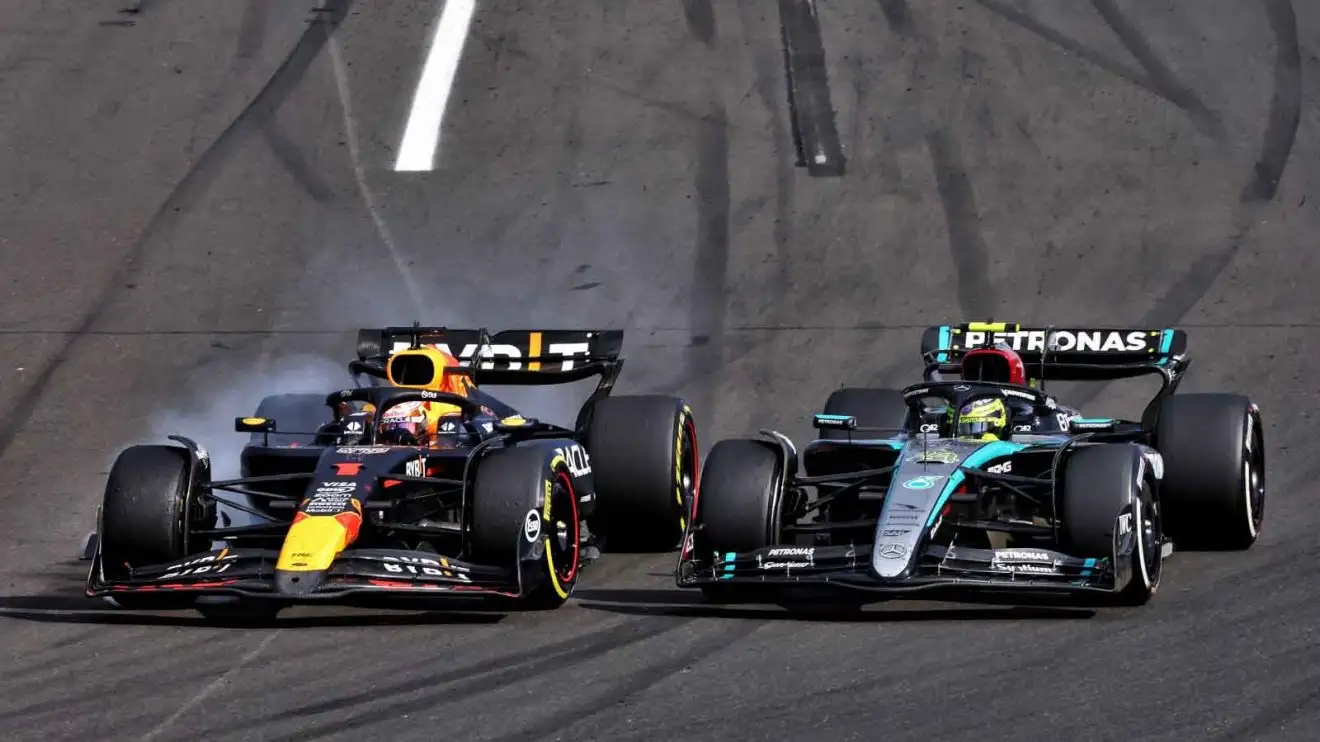 Max Verstappen locks up on the inside of Lewis Hamilton.