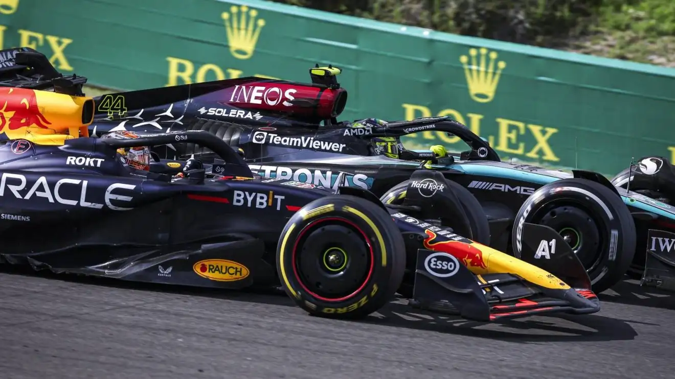 Max Verstappen and Lewis Hamilton side-by-side at the 2024 Hungarian Grand Prix.