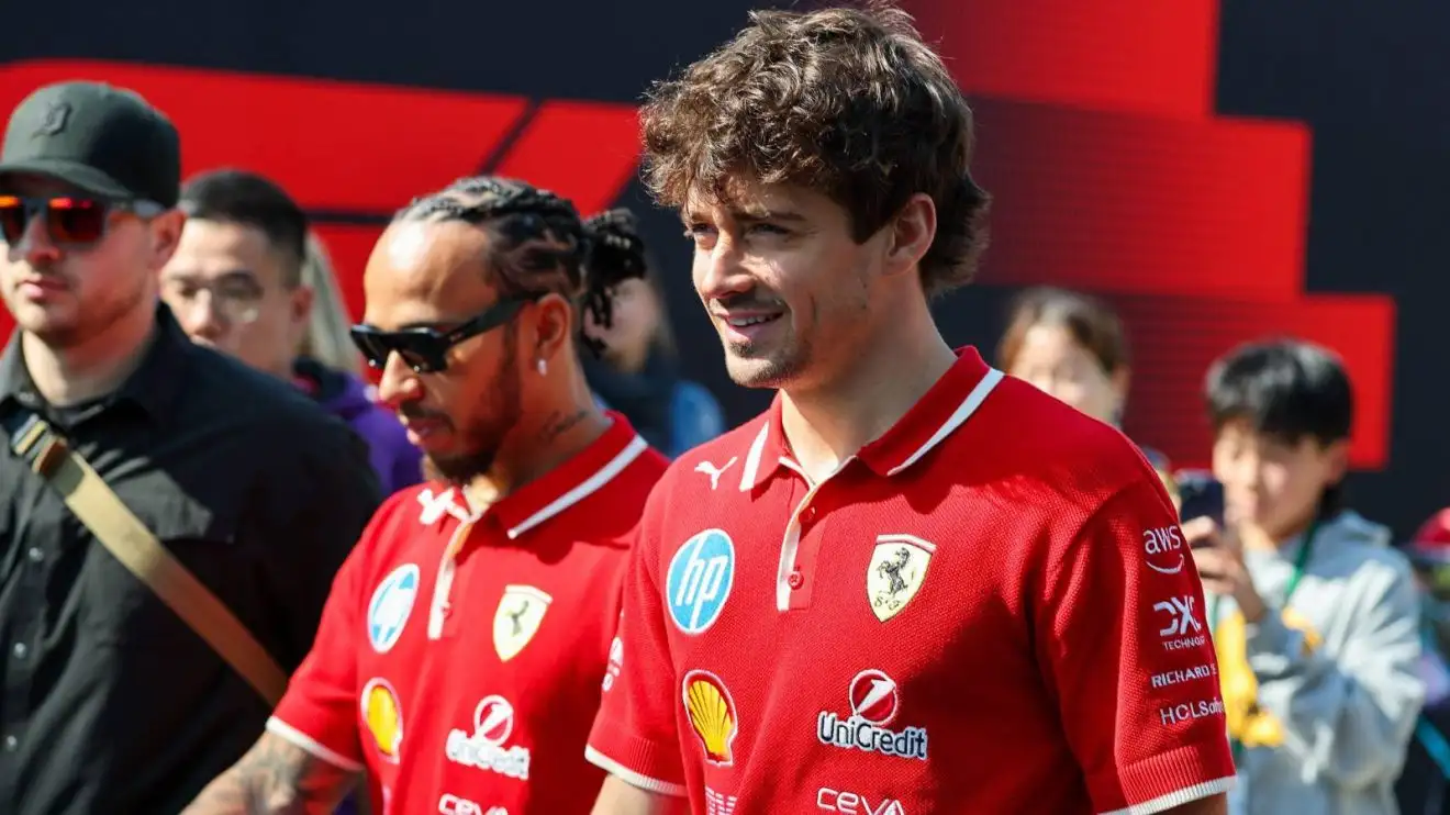 Ferrari team-mates Charles Leclerc and Lewis Hamilton walk through the paddock at the 2025 Chinese Grand Prix