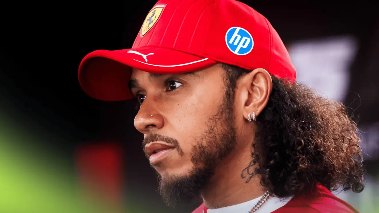 Lewis Hamilton looks concerned as he faces the media in Bahrain