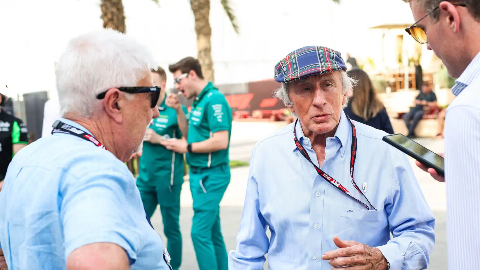 Michael Schumacher signs Stewart's charity helmet for Tyrrell demo run in Bahrain