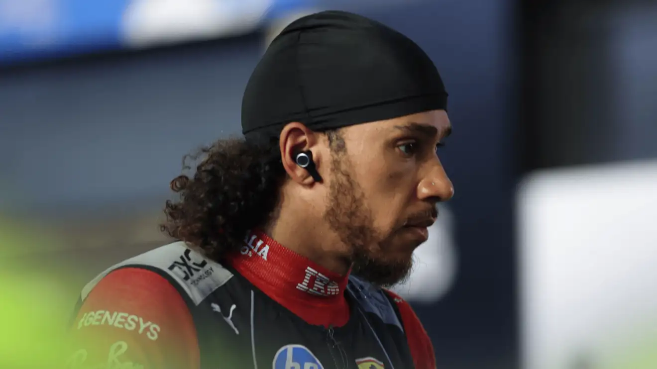 Lewis Hamilton looks stern as he makes his way through the pit lane ahead of the start in Saudi Arabia