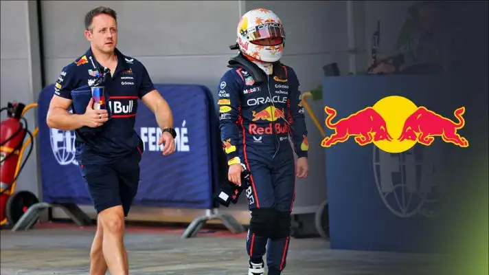 Yuki Tsunoda walks down the pit lane