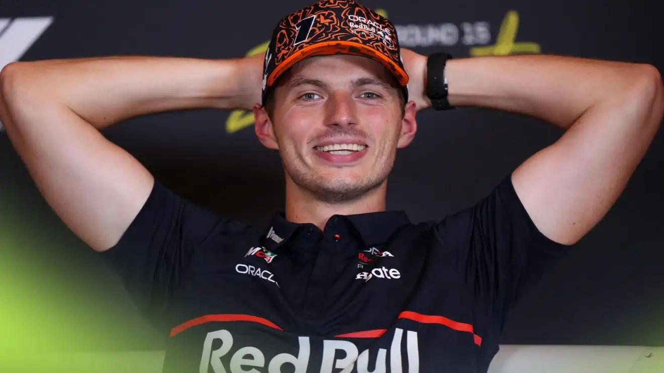 Red Bull's Max Verstappen looks happy in a 2025 Dutch Grand Prix press conference