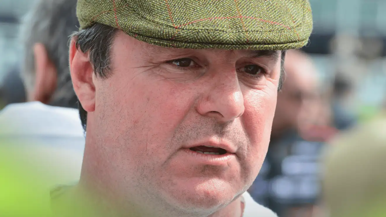 A close-up shot of Mark Blundell wearing a flat cap