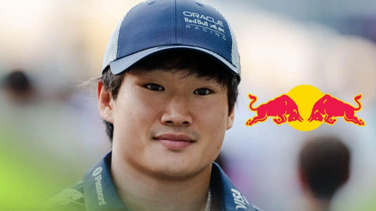 Red Bull driver Yuki Tsunoda pictured at the 2025 Singapore Grand Prix, as a Red Bull logo appears on his right