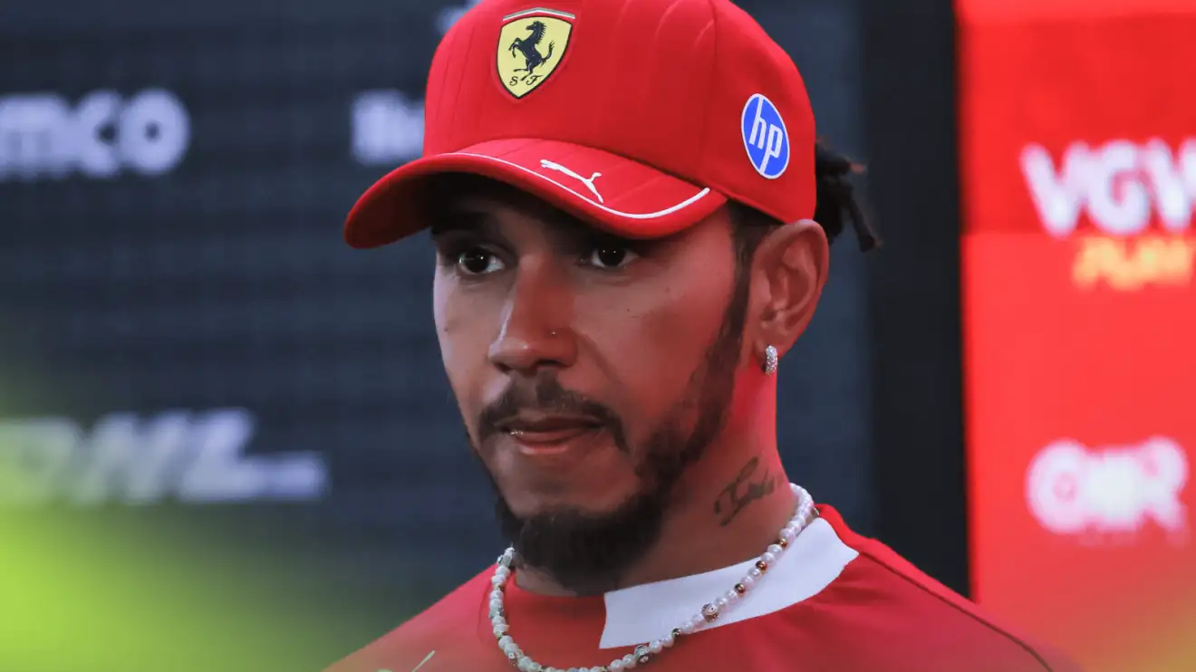 Lewis Hamilton looks tense as he faces the media in Singapore