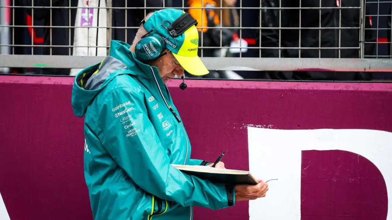 Adrian Newey, notebook in hand, on the grid at Silverstone.
