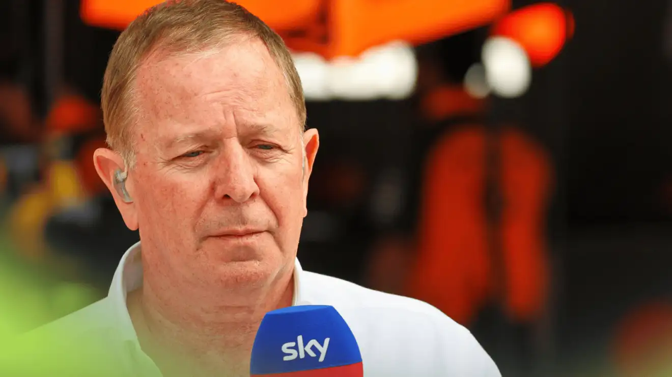 Martin Brundle looks on while on Sky F1 duty outside the McLaren garage