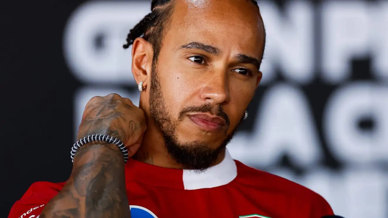 Lewis Hamilton speaking with the media
