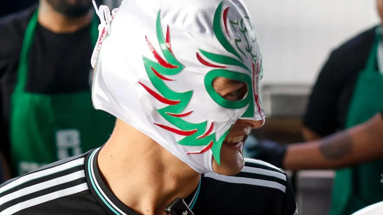 George Russell wearing a Lucha Libre mask