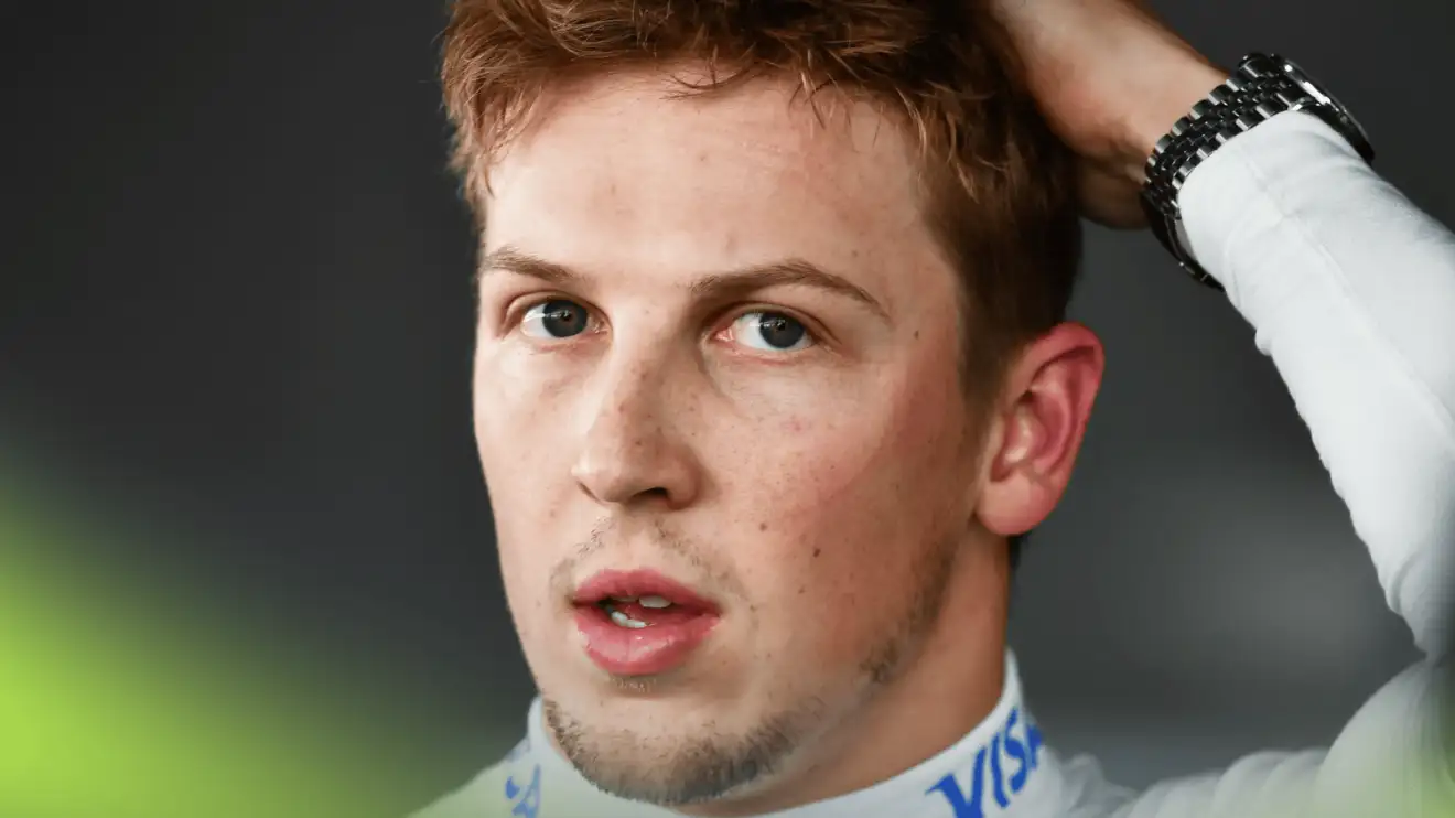 A close-up shot of Liam Lawson as he faces the media