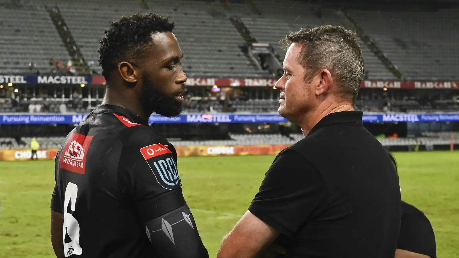 Sharks coach Sean Everitt talks with Siya Kolisi after a game.