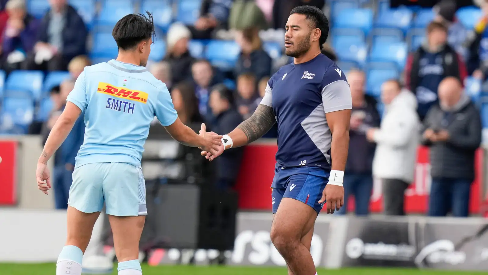 England's Marcus Smtih and Manu Tuilagi greet each other before Harlequins v Sale Sharks clash in the Premiership.