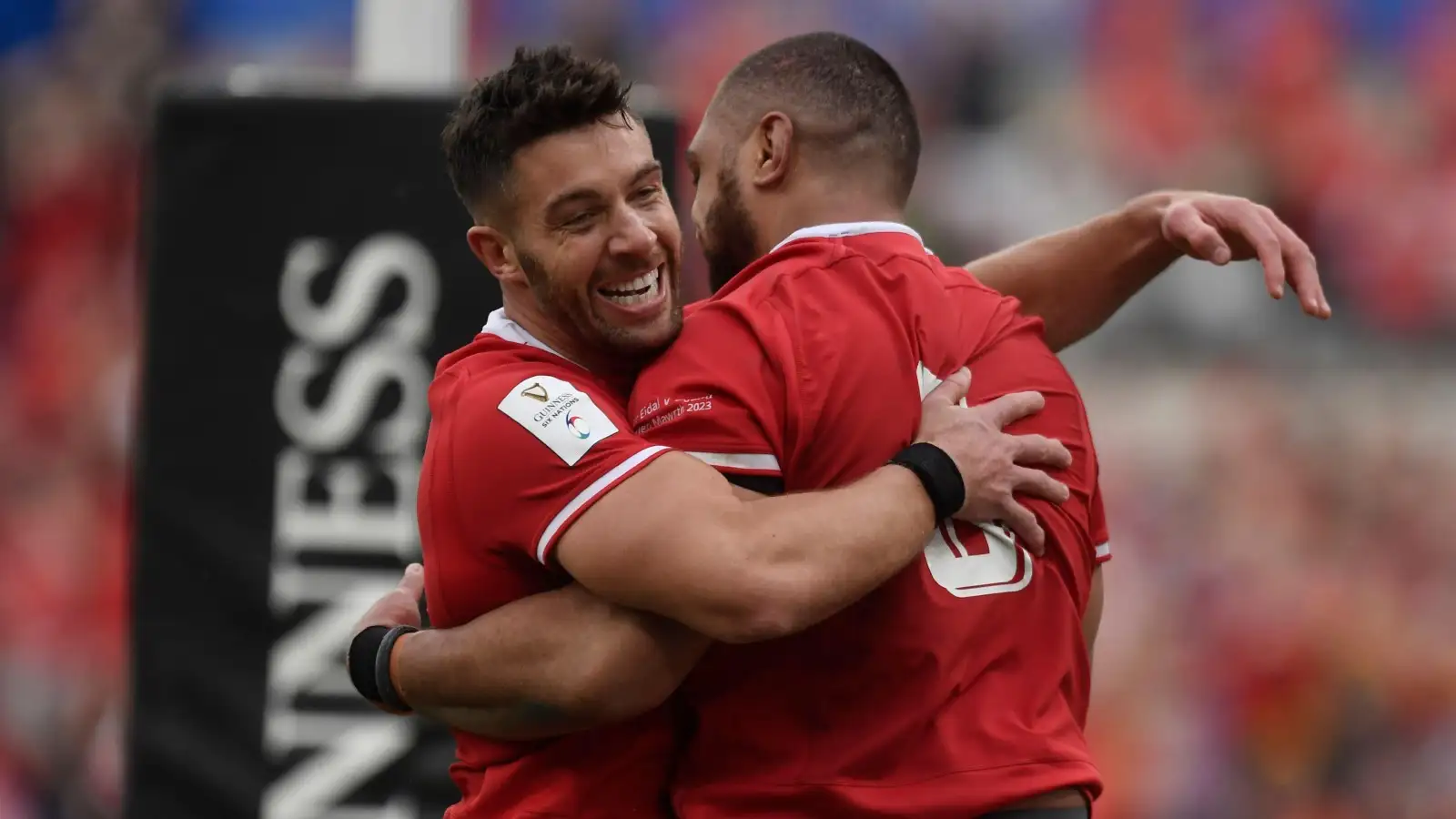 Wales stars Rhys Webb and Taulupe Faletau embrace after a try against Italy