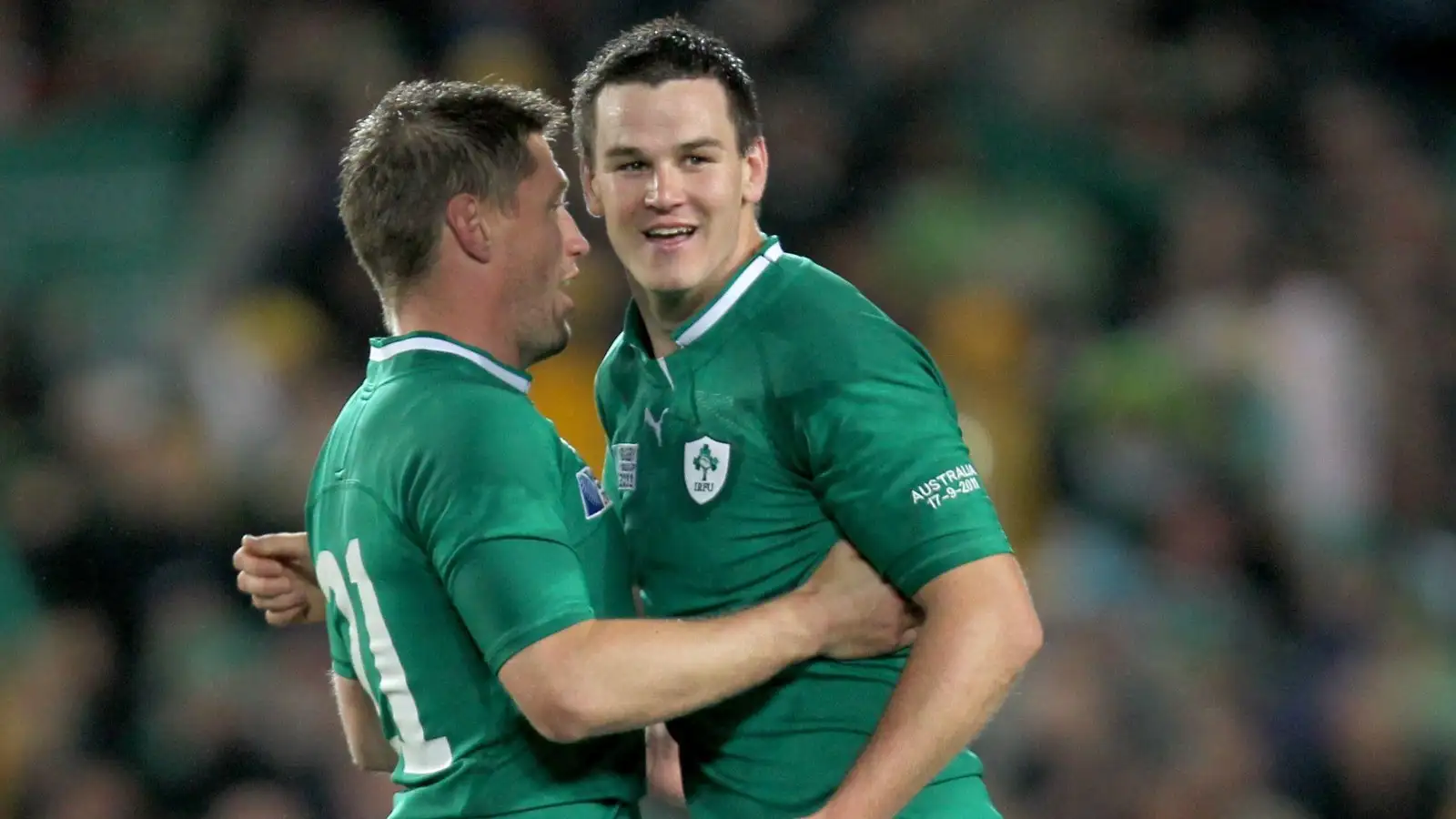 Johnny Sexton and Ronan O'Gara embrace during a Test for Ireland
