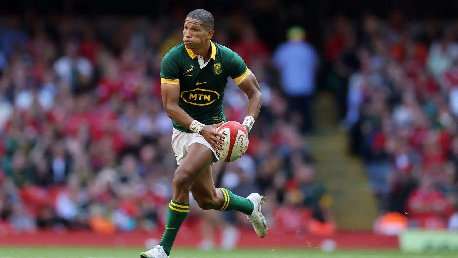 Springbok fly-half Manie Libbok with ball in hand against Wales.