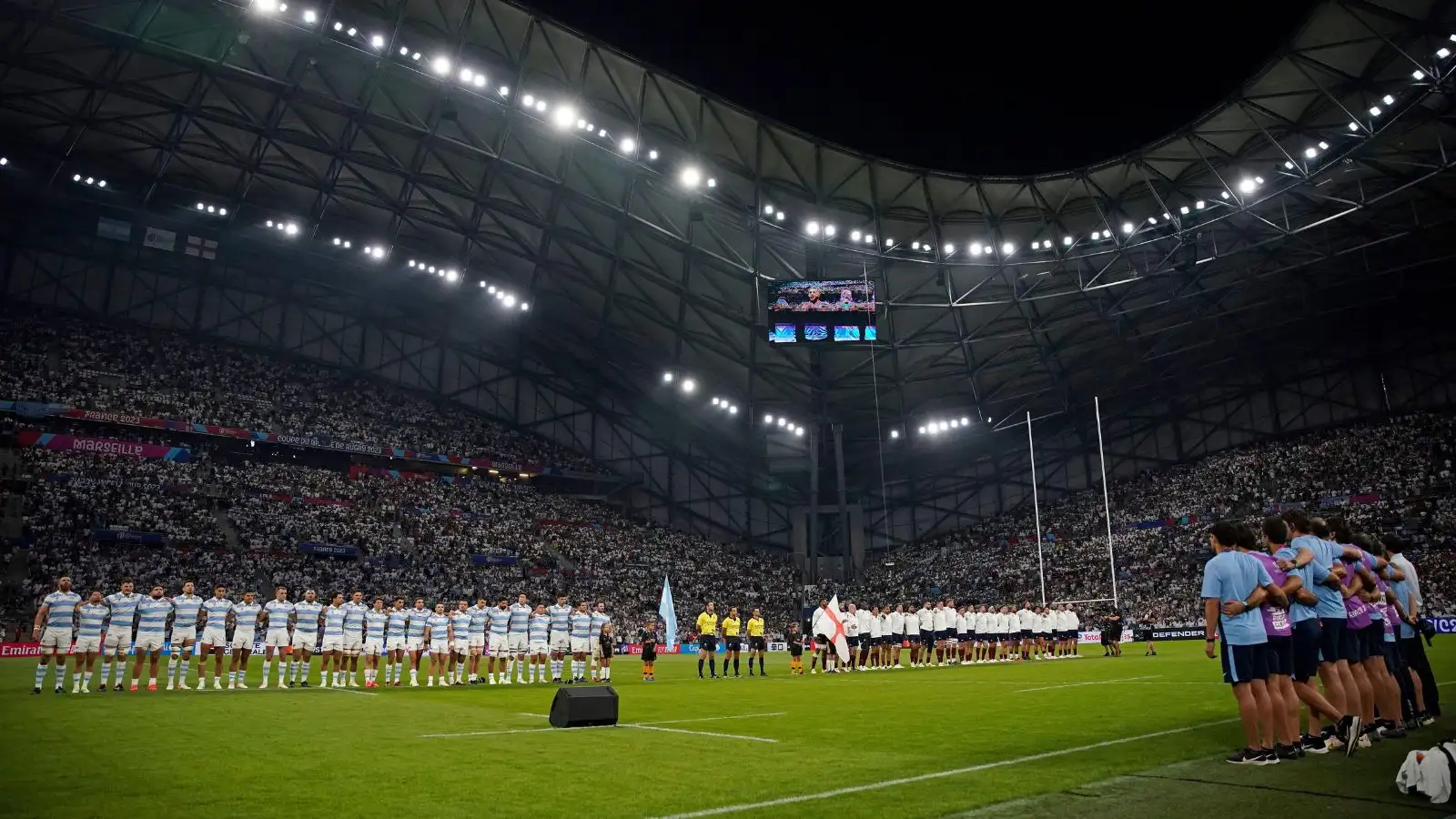 Argentina, left, and England stand for the anthems before the Rugby World Cup Pool D match between England and Argentina in the Stade de Marseille, Marseille, France Saturday, Sept. 9, 2023.
