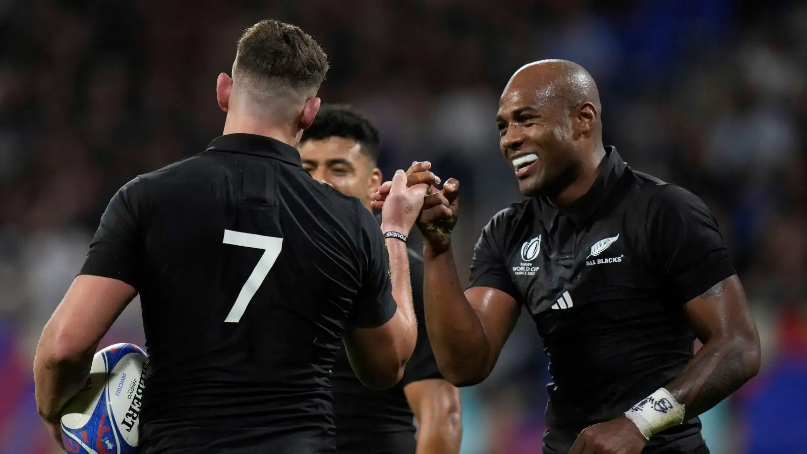 All Blacks flanker Dalton Papali'i celebrates with teammate Mark Telea, after scoring a try during the Rugby World Cup Pool A match.