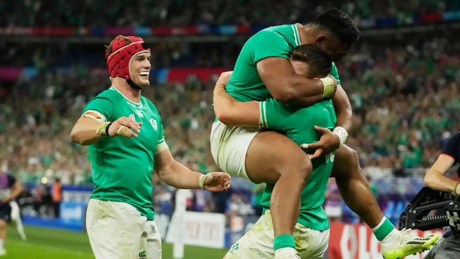 Ireland players celebrate a try against Scotland.