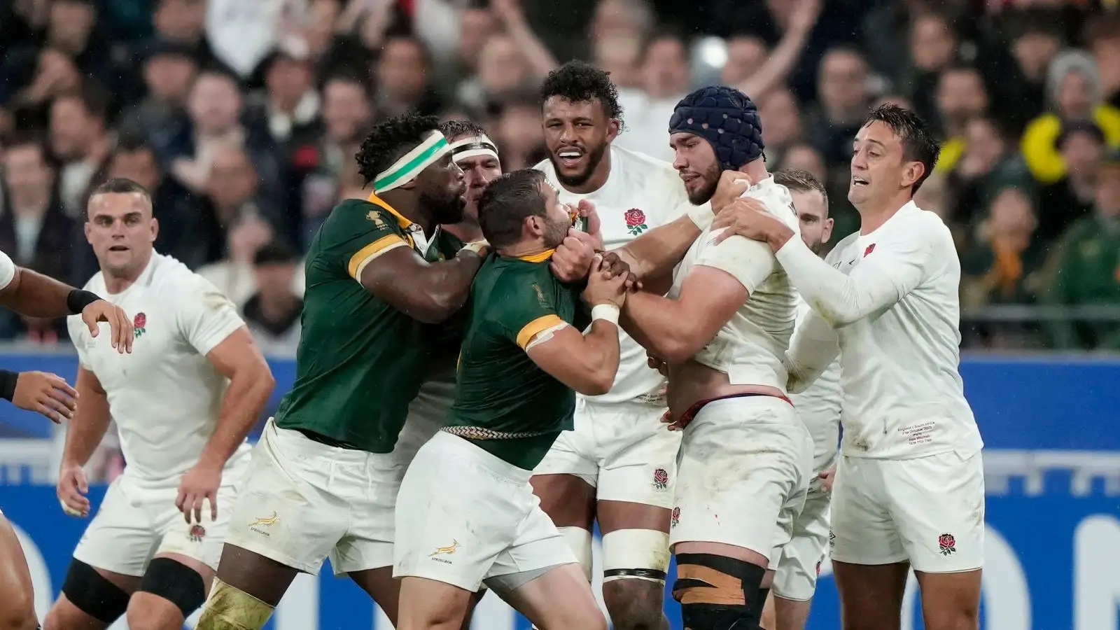 Teammates separate England's George Martin and South Africa's Cobus Reinach as they scuffle during the Rugby World Cup semifinal match between England and South Africa