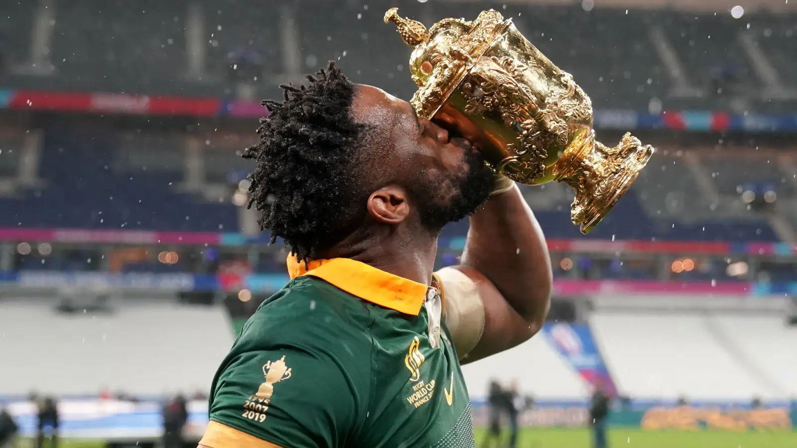 Springboks skipper Siya Kolisi kissing Rugby World Cup.