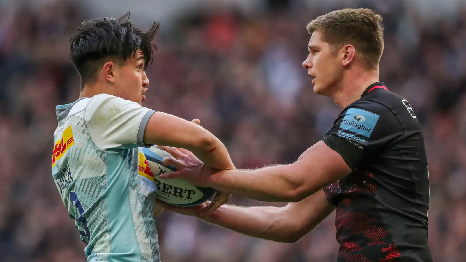 Harlequins fly-half Marcus Smith clashes with Saracens captain Owen Farrell.