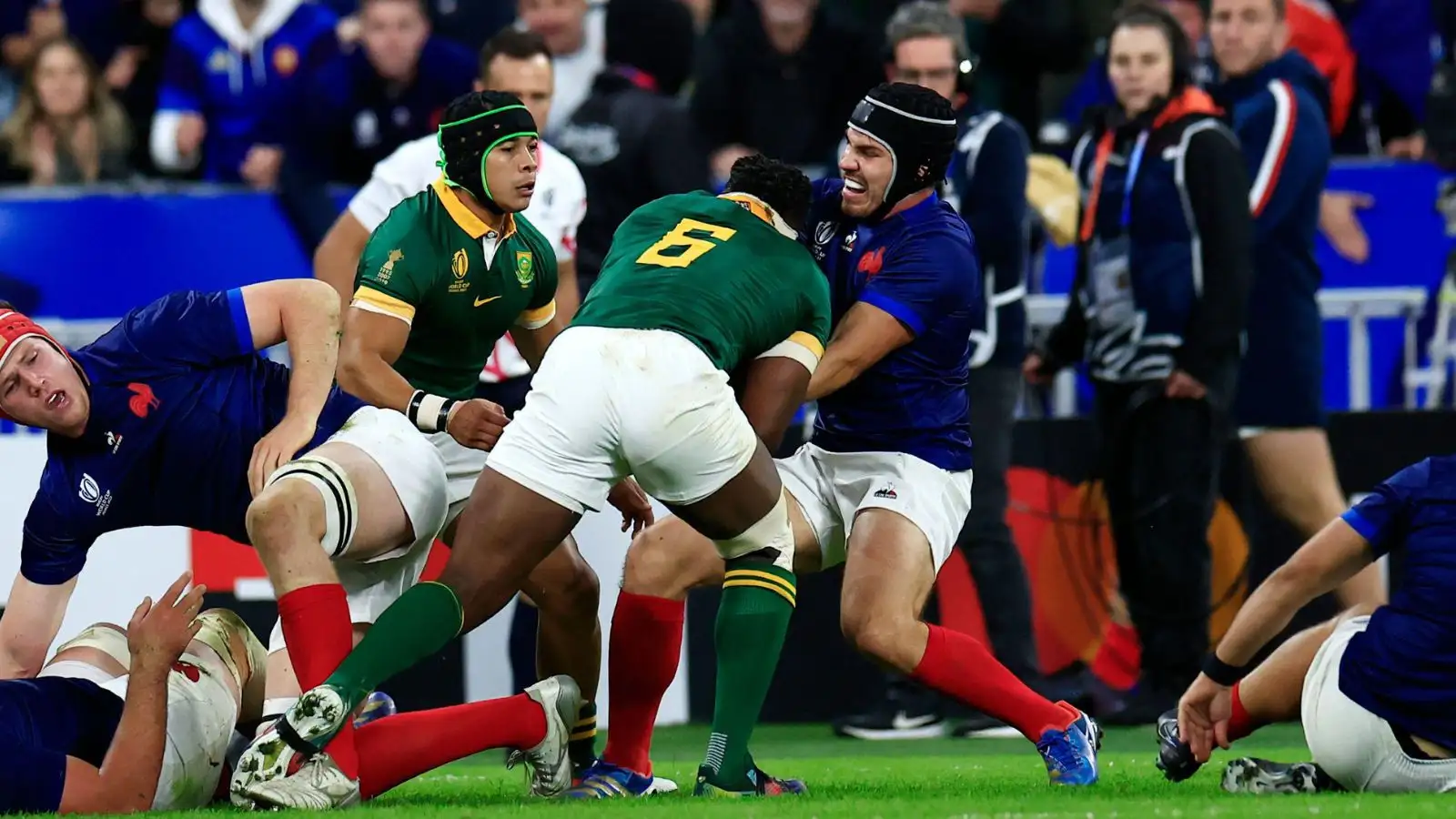 France's Antoine Dupont challenges for the ball with Springboks' captain Siya Kolisi during the Rugby World Cup quarterfinal match between France and South Africa at the Stade de France.
