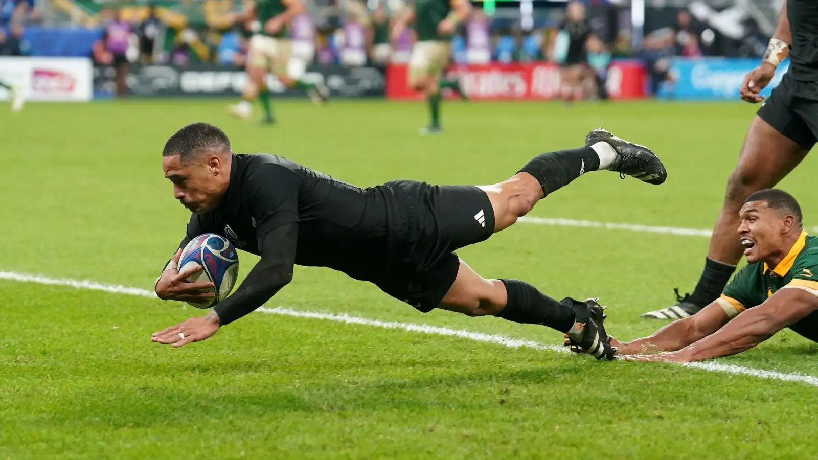 All Blacks' scrumhalf Aaron Smith scores a try which is ruled out for a knock-on following a TMO review during the Rugby World Cup 2023 final match between New Zealand and South Africa at the Stade de France in Paris.